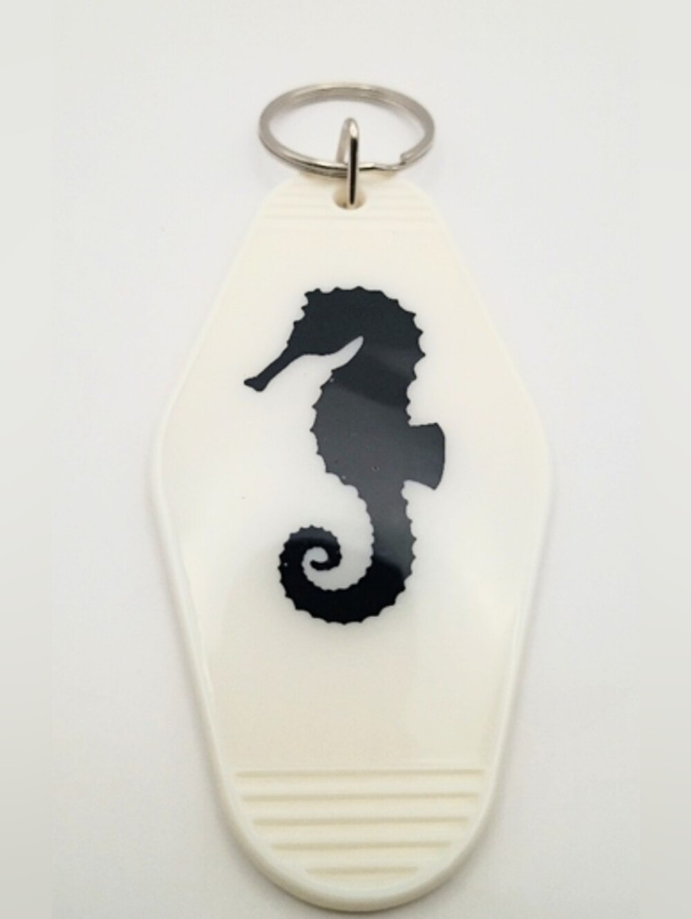 White Keychain with Black And White Seahorse Design Motel Keychain